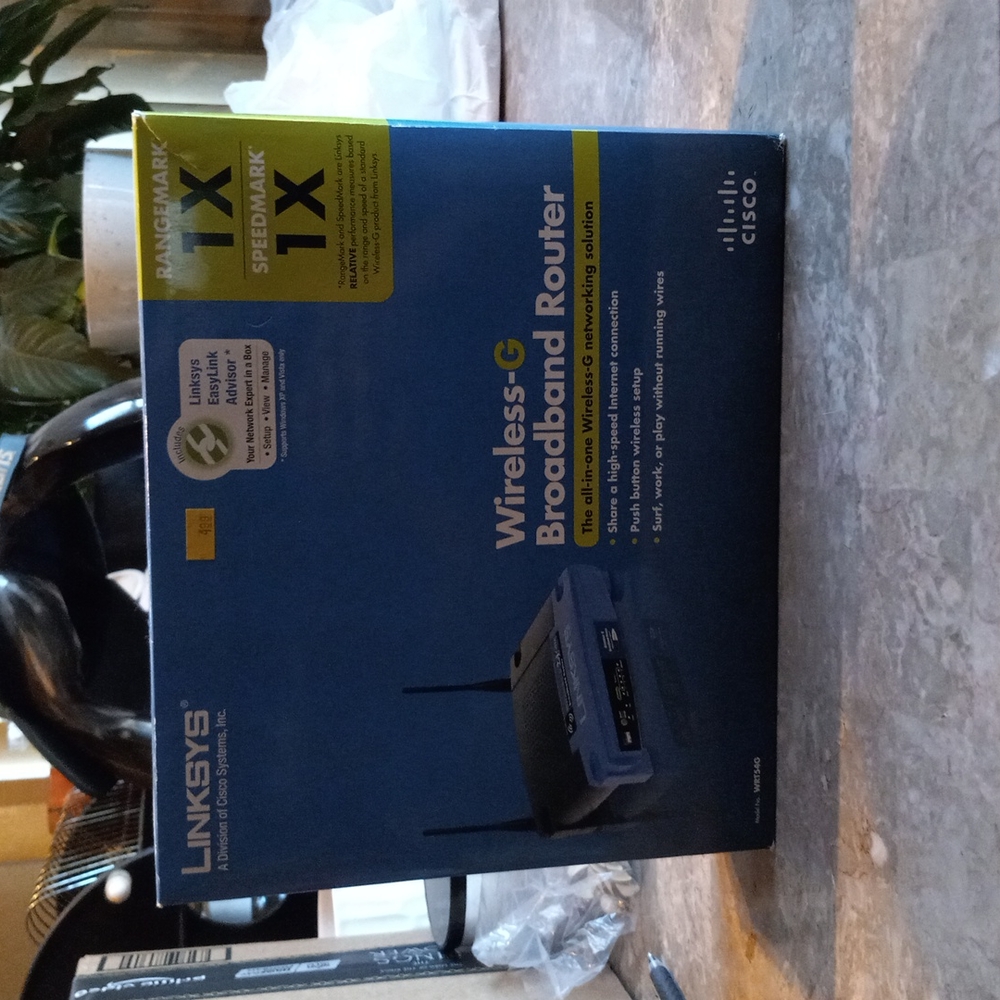 Linksys wireless-G Broadband router black and blue about 9 inches .